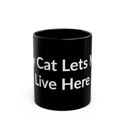 Black Mug - My Cat Lets Me Live Here