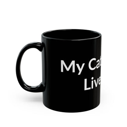 Black Mug - My Cat Lets Me Live Here